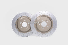 Two drilled and slotted brake rotors with a metallic silver outer ring and a tan center, featuring the 'Spectworks' logo on the front, set against a light gray background.